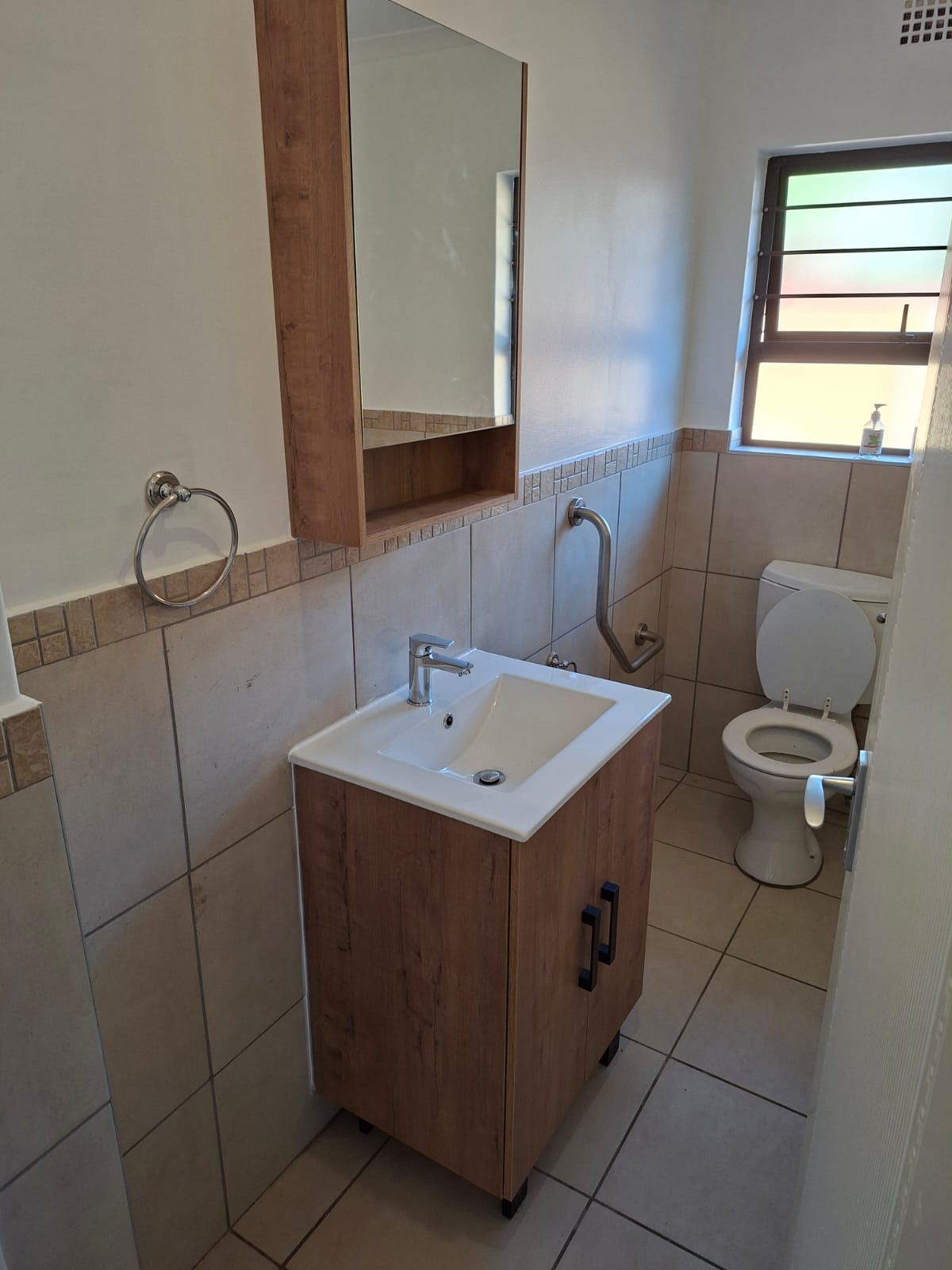 Completed bathroom renovation with a toilet and basin