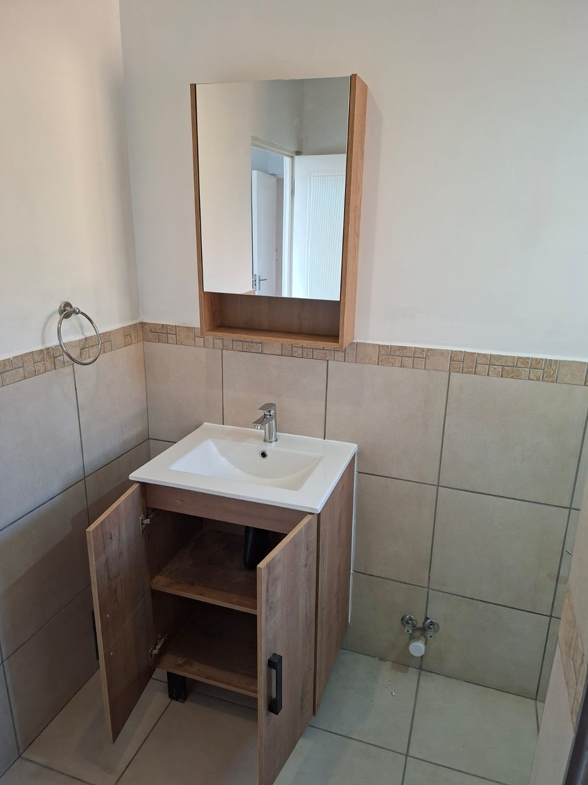 Bathroom renovation with a wooden vanity
